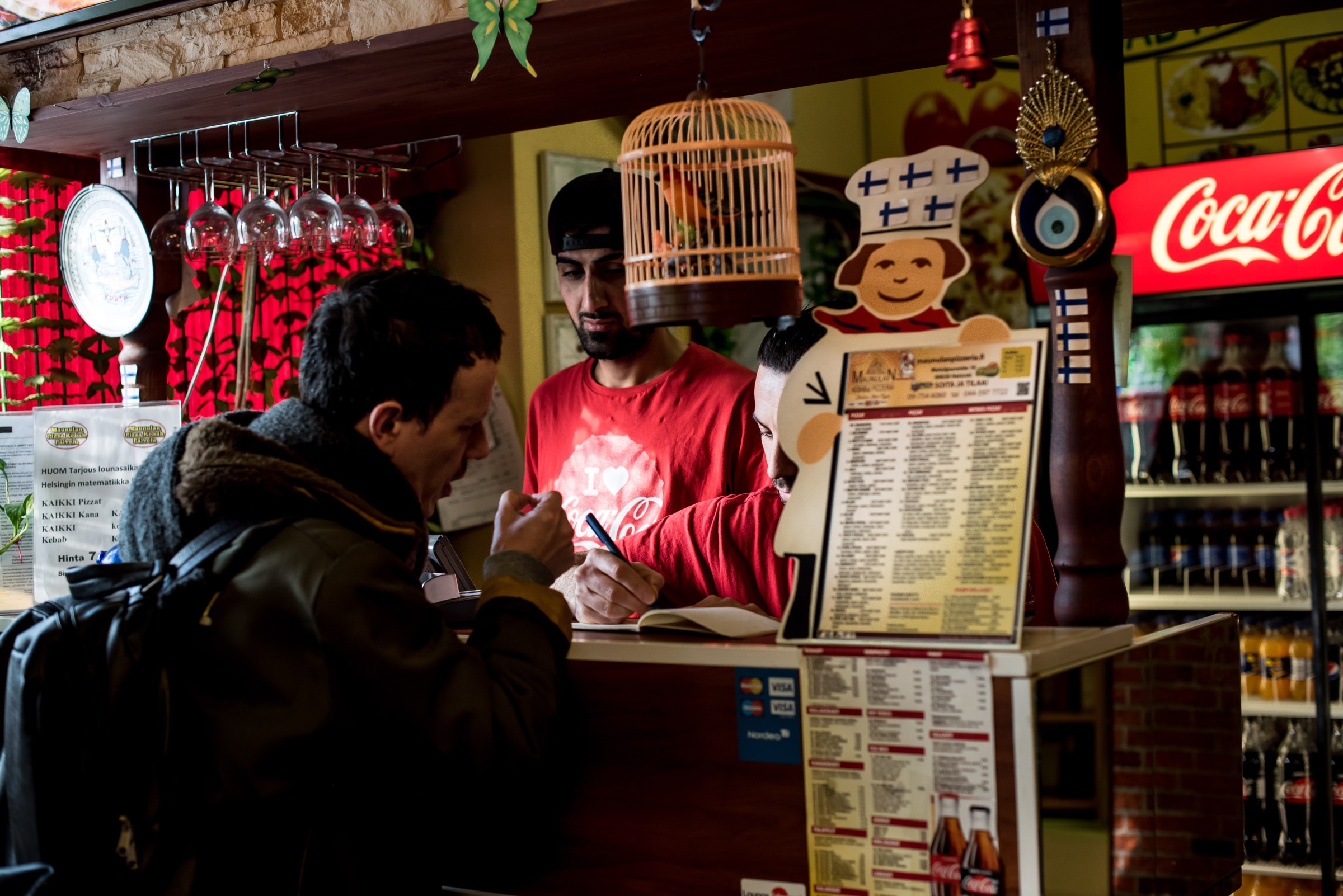 Rogerio Nuno Costa and a man talking in a pizzeria